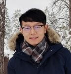 Headshot of Siliang Li in blue winter coat against a snowy forest