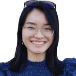 Headshot of Ha Chau Chloe Nguyen wearing a blue blouse on a white background